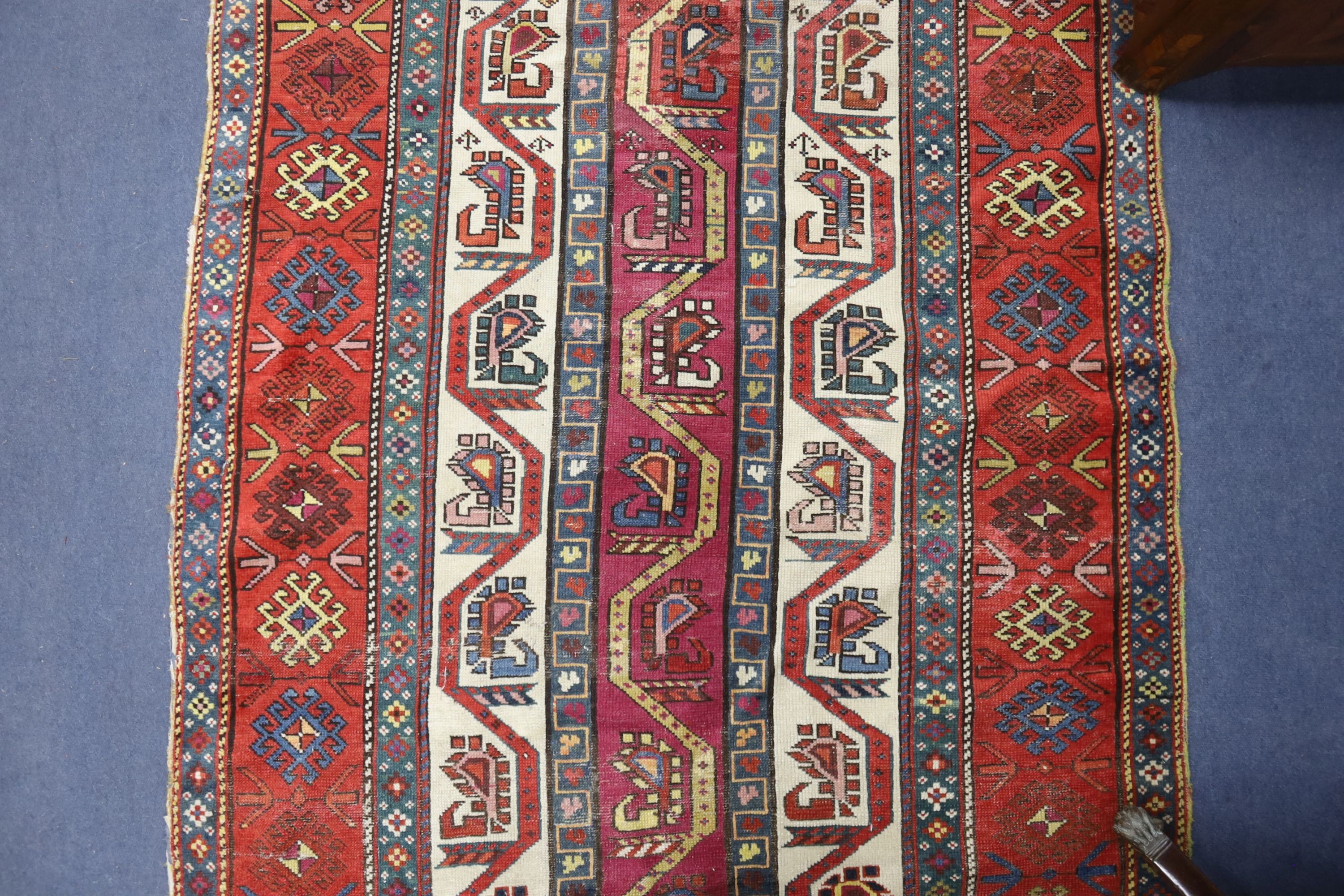 A Caucasian geometric rug, 284 x 118cm